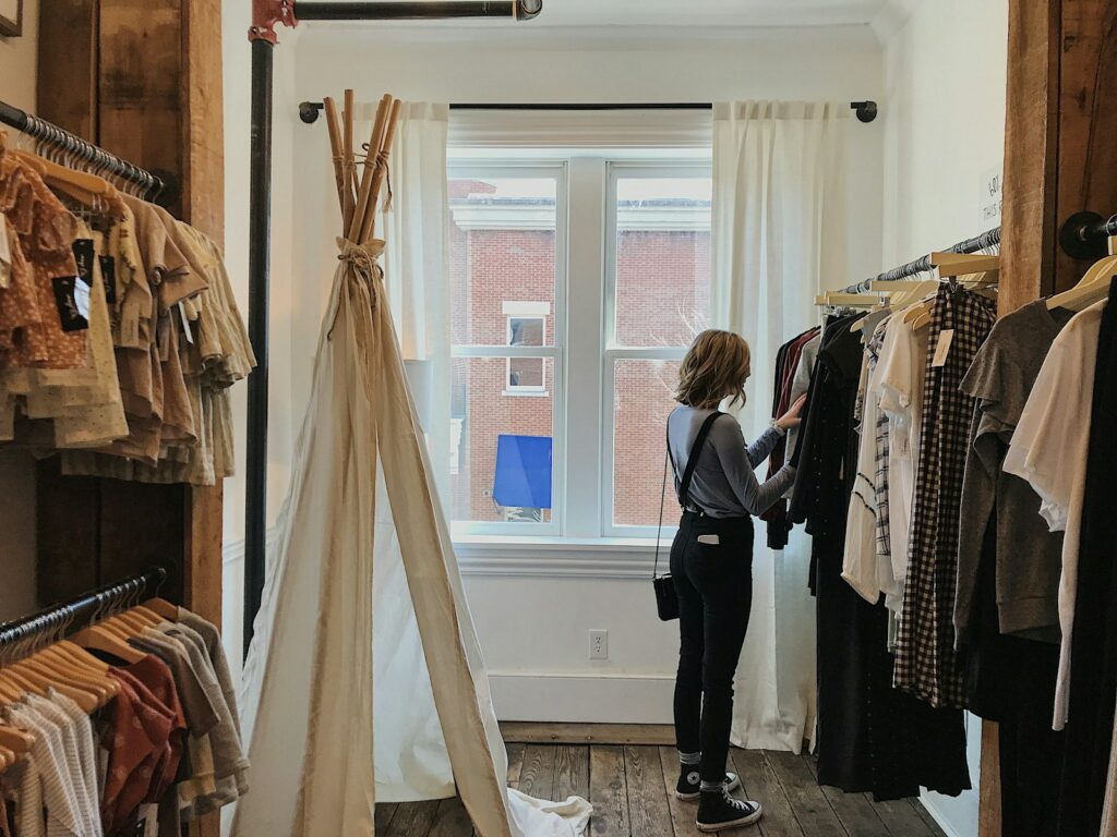 woman standing selecting clothes