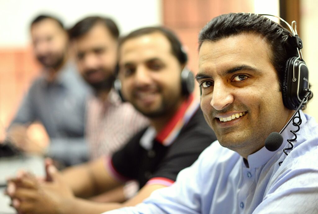 man in white button up shirt smiling