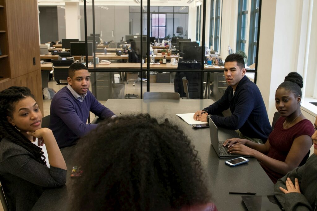 a group of people sitting around a table