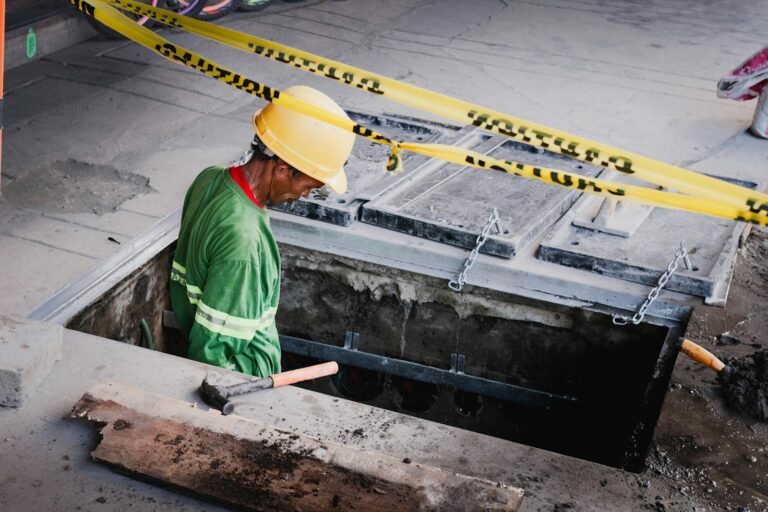 a man in a hard hat working on a construction site