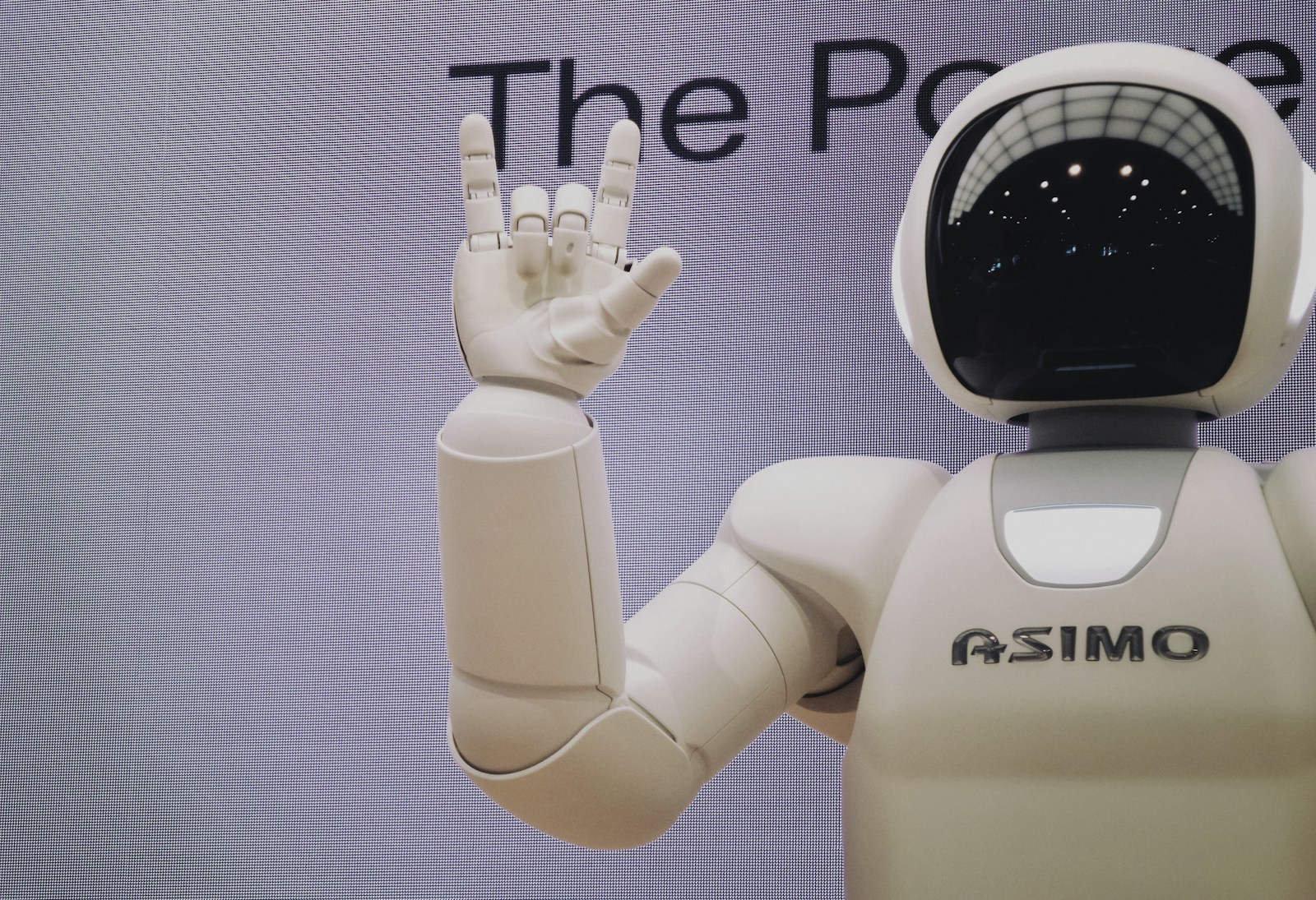 Asimo robot doing handsign